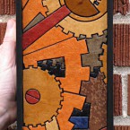 Gears (mini vertical). Recycled paper-tile mosaic. 59 pieces. $107 tax-free. 5"Wx14"H. Very reasonable shipping available.